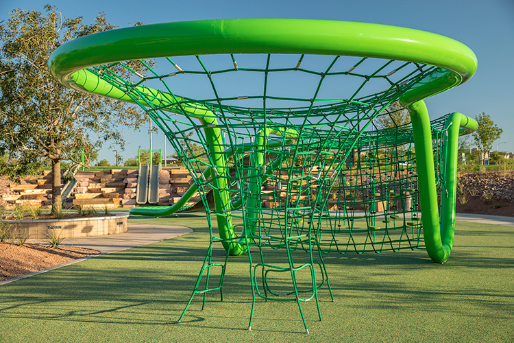 A green and blue playground slide.