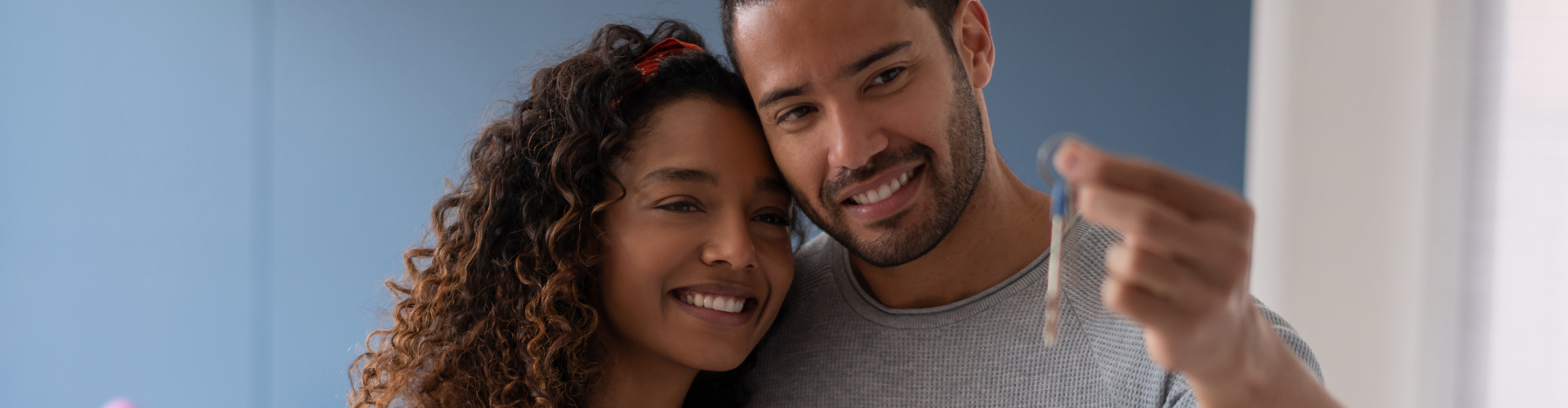 A man and a woman smiling.