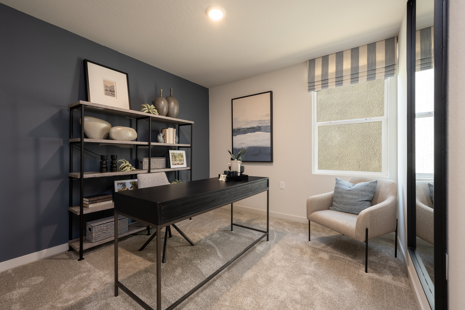 A room with a table and chairs.