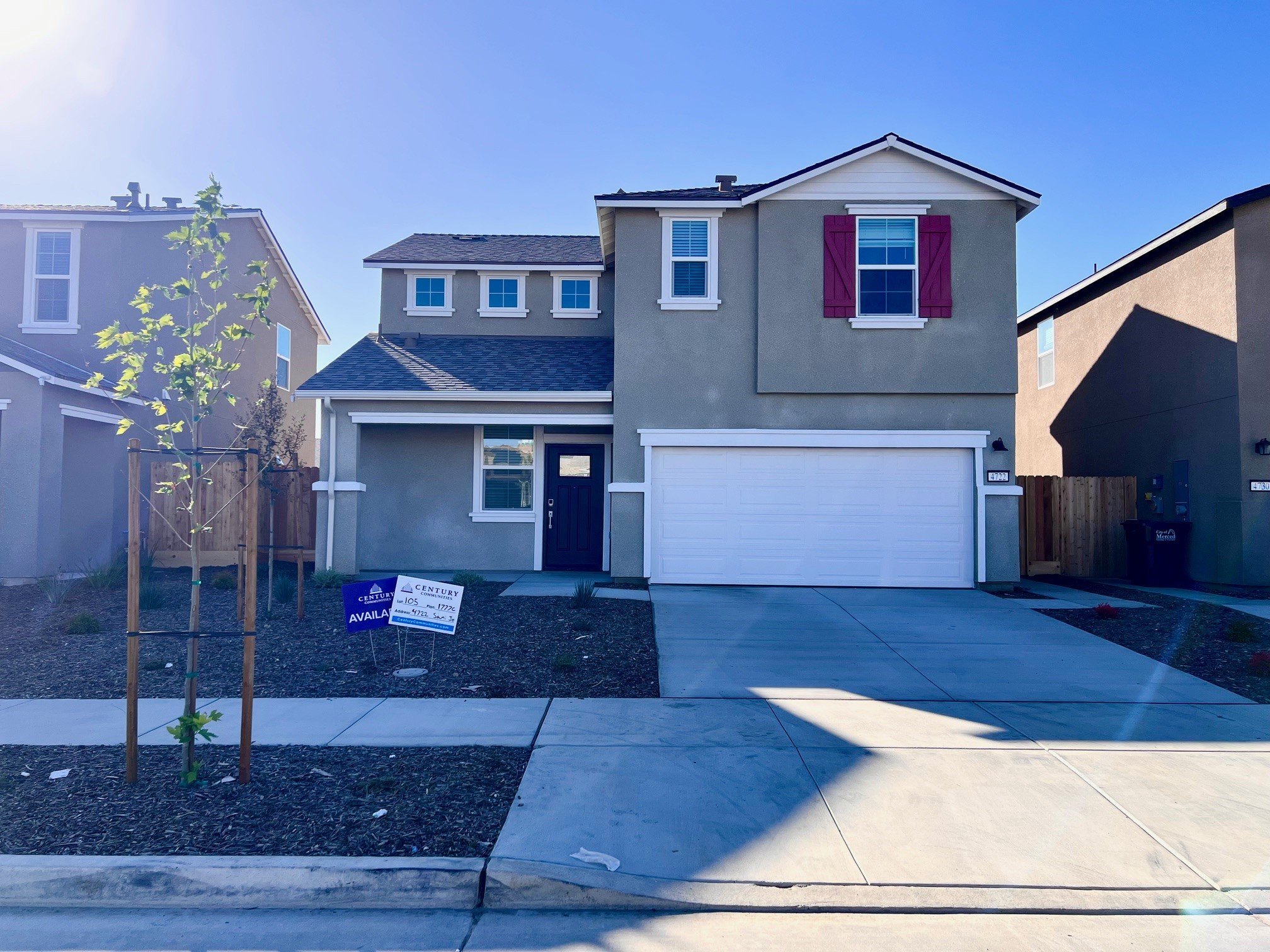 A house with garages and a fence.