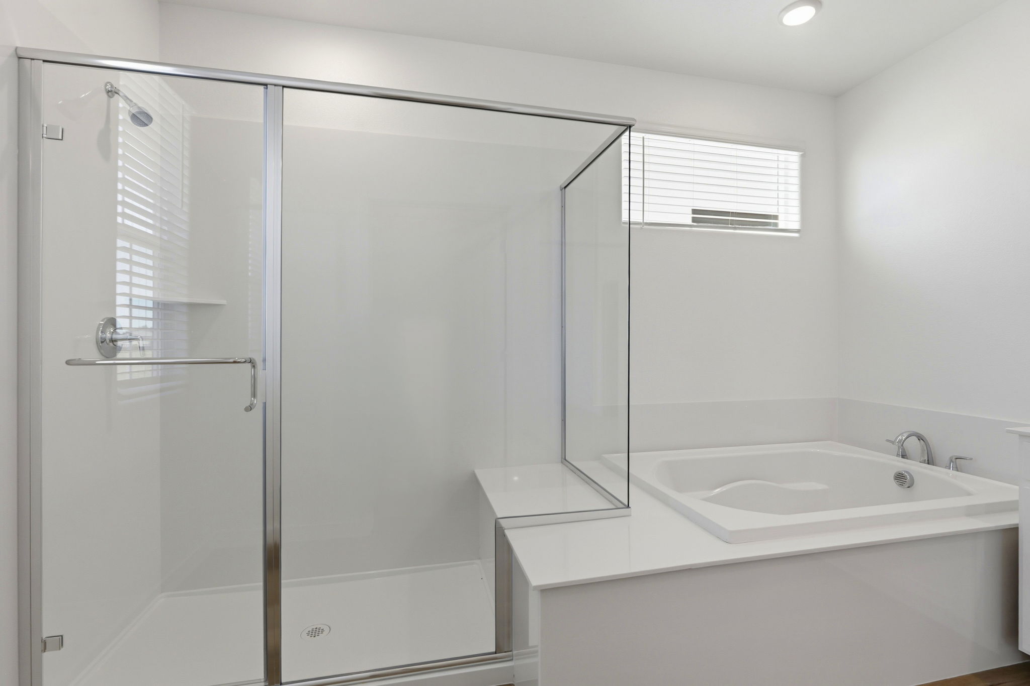 A bathroom with a glass shower.