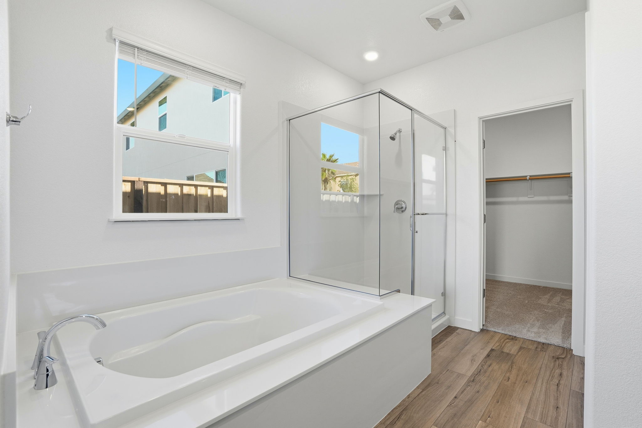 A bathroom with a tub and shower.