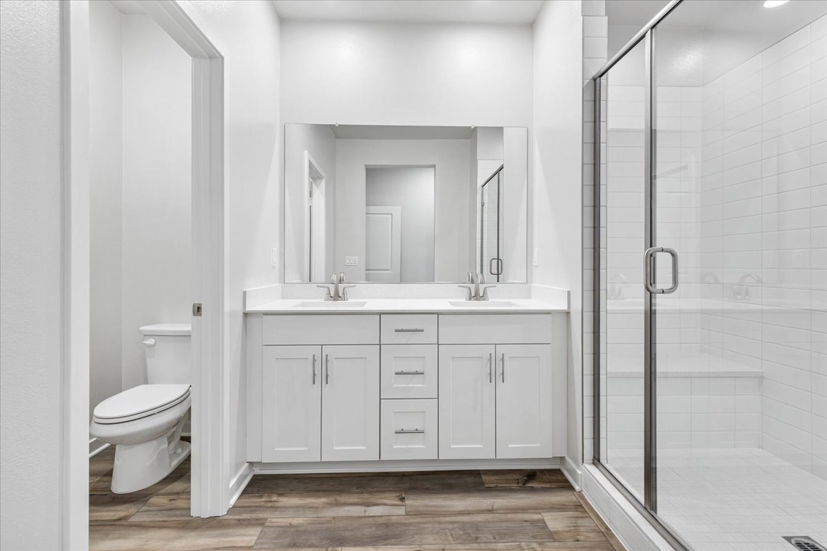 A bathroom with a glass shower.