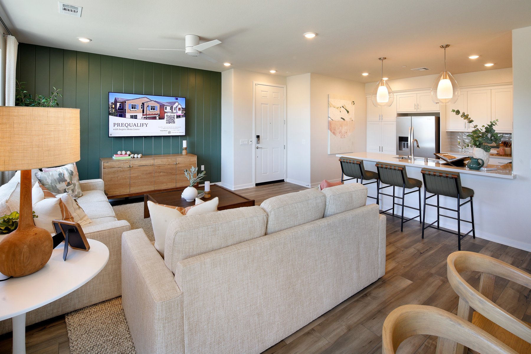 A living room with a couch and chairs.