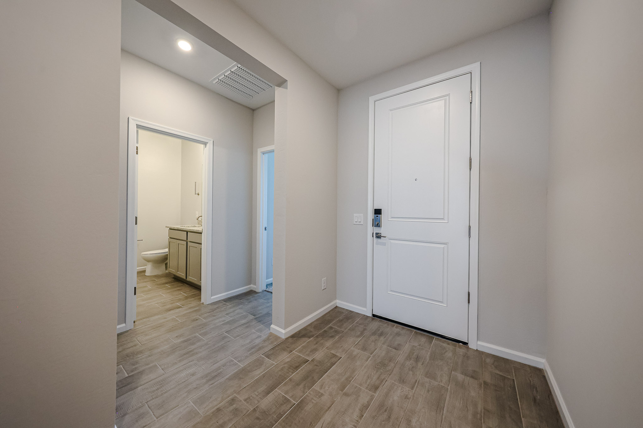 A bathroom with white doors.