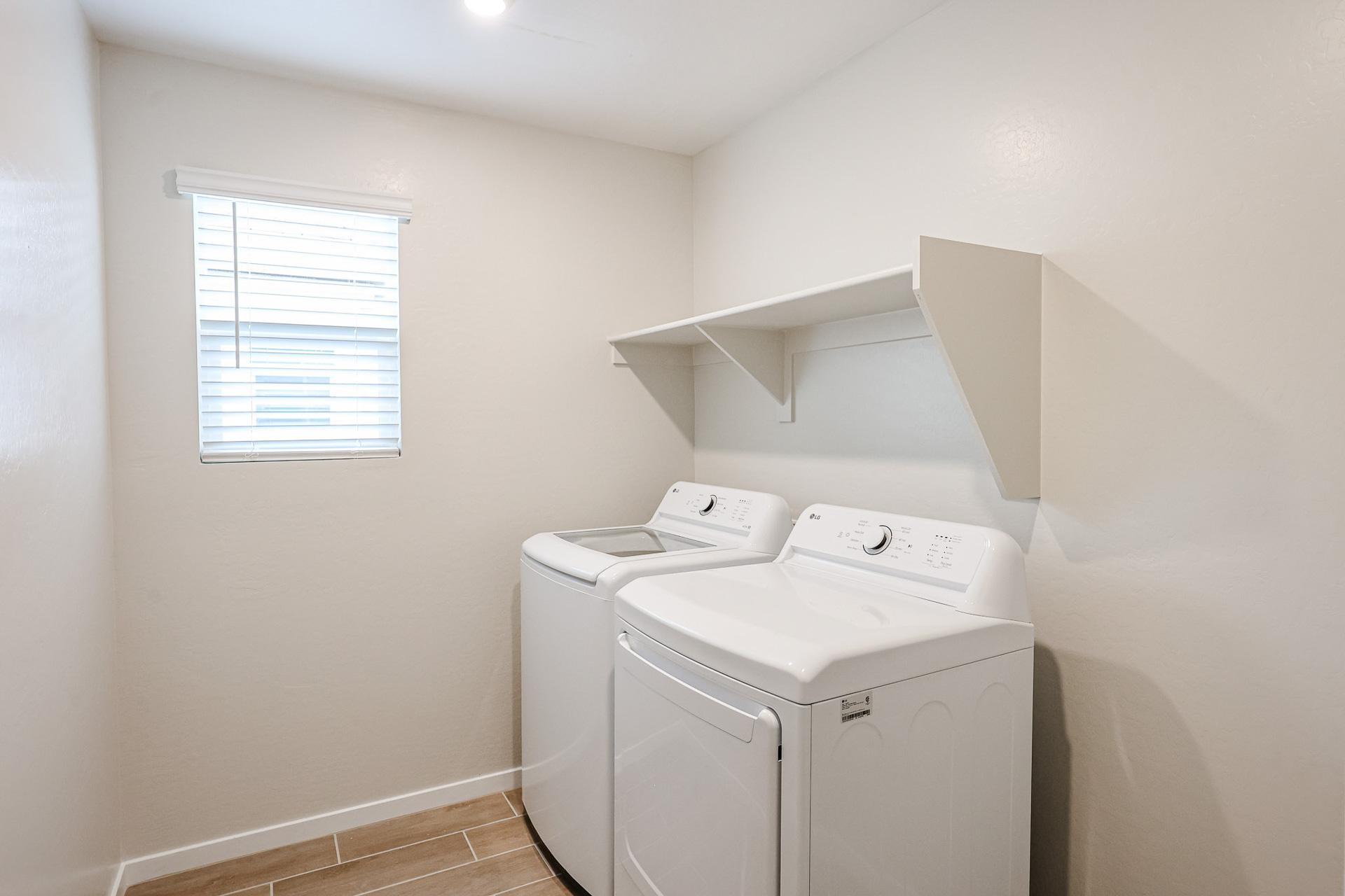 A washing machine in a room.
