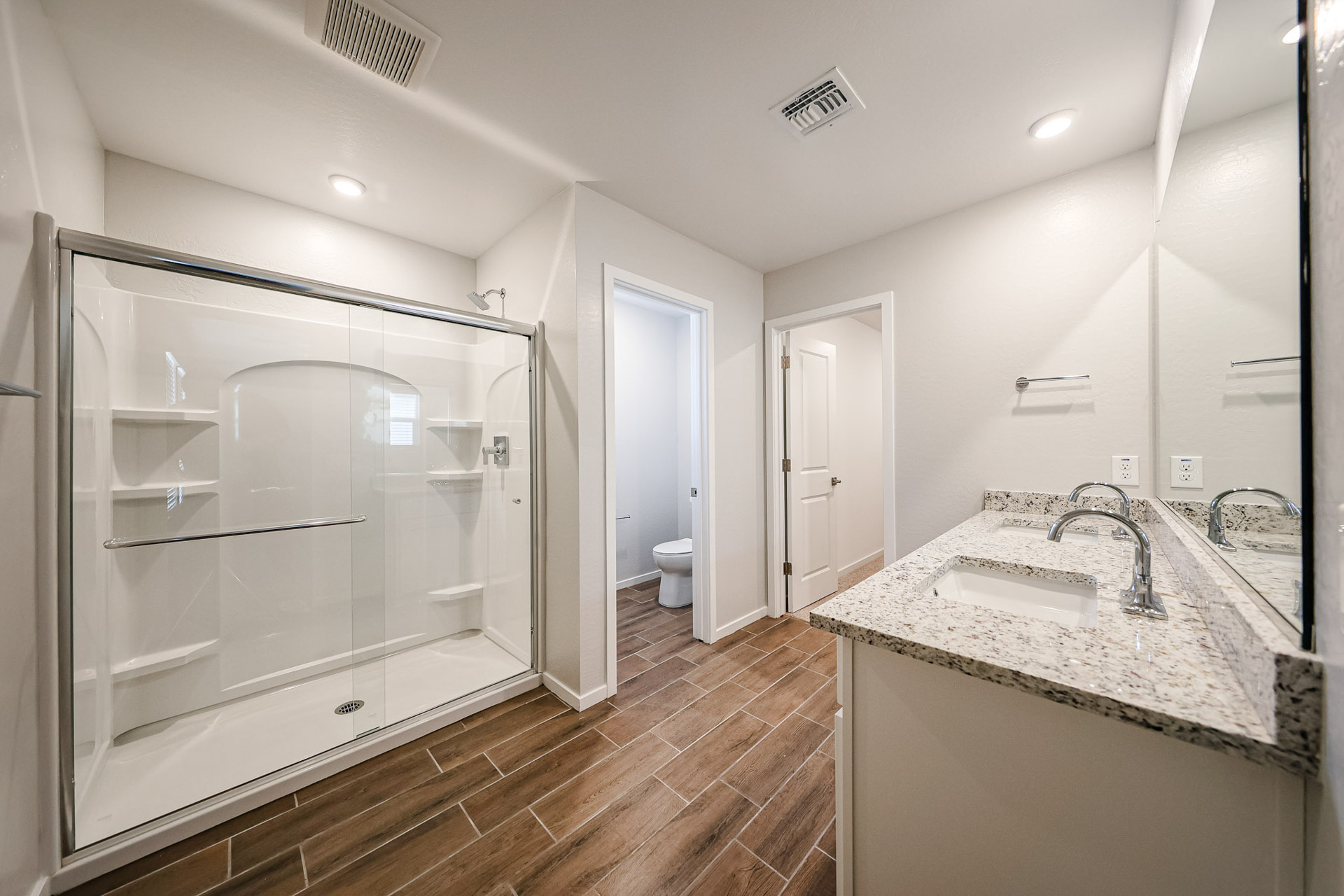 A bathroom with a glass shower.
