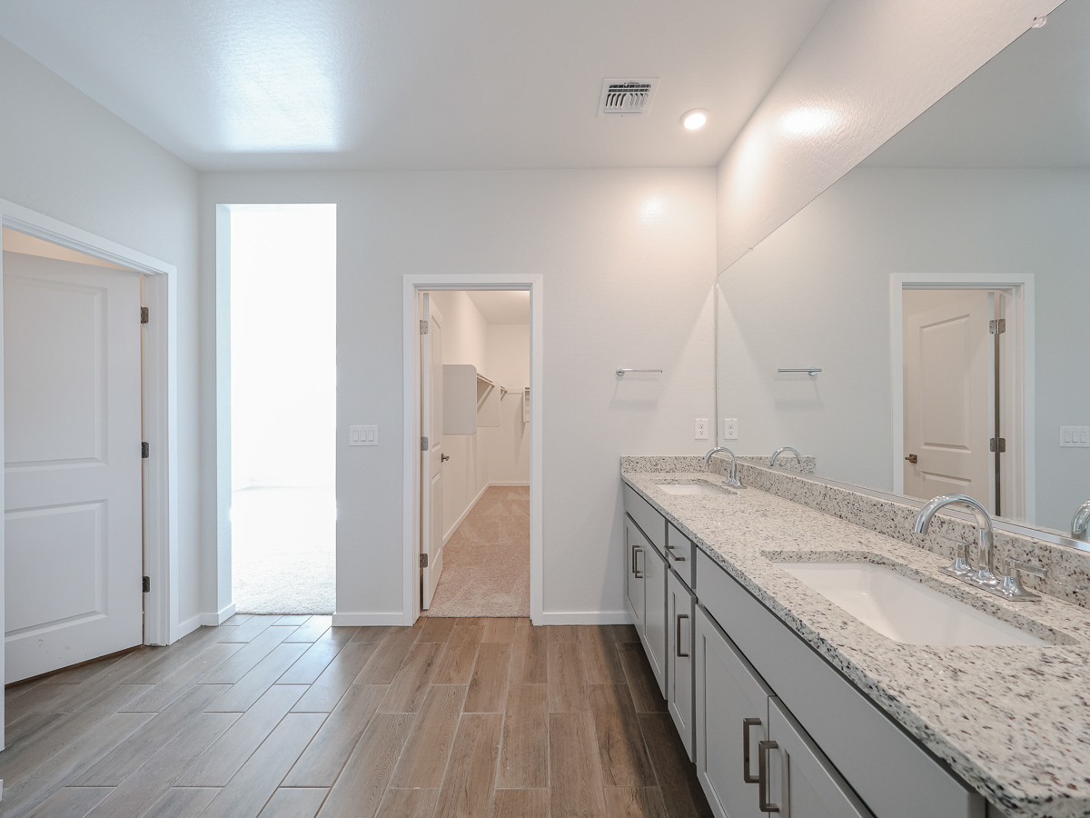 A bathroom with a marble countertop.