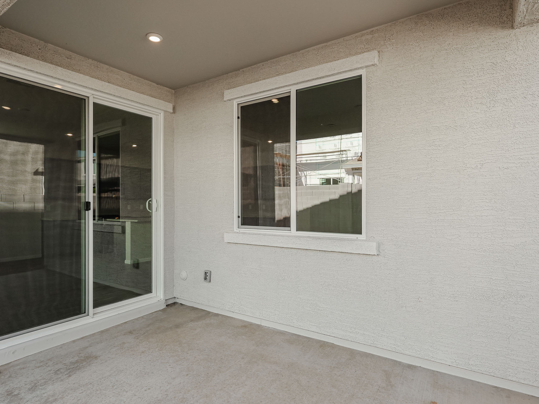 A room with a window and a door.