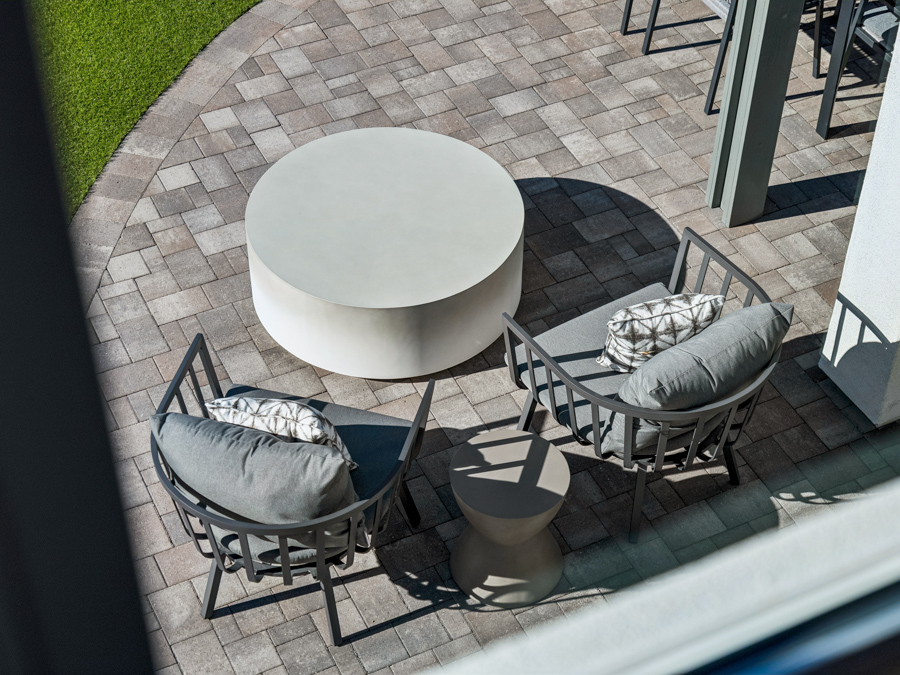 A patio with a table and chairs.
