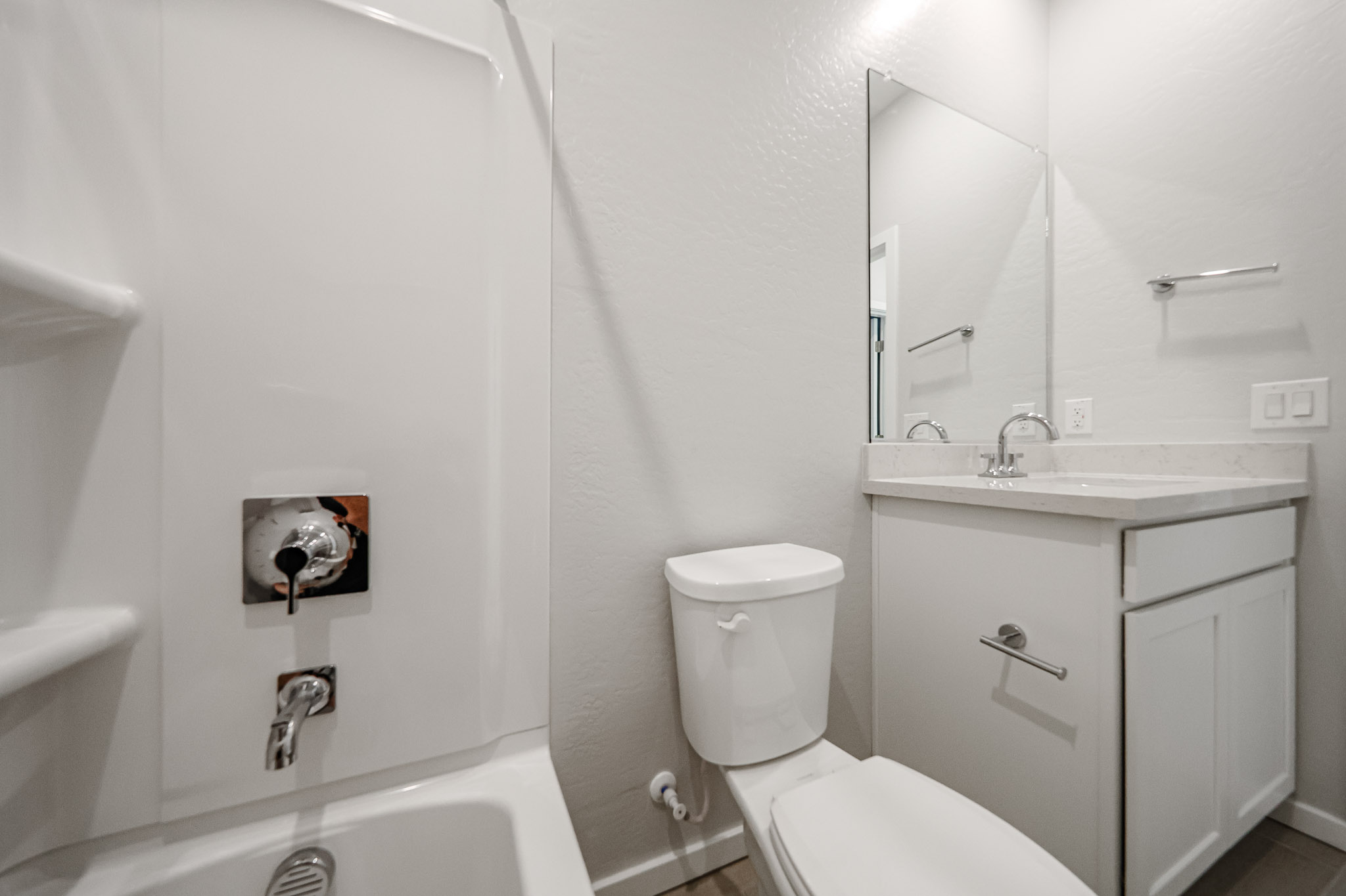 A bathroom with a toilet and sink.