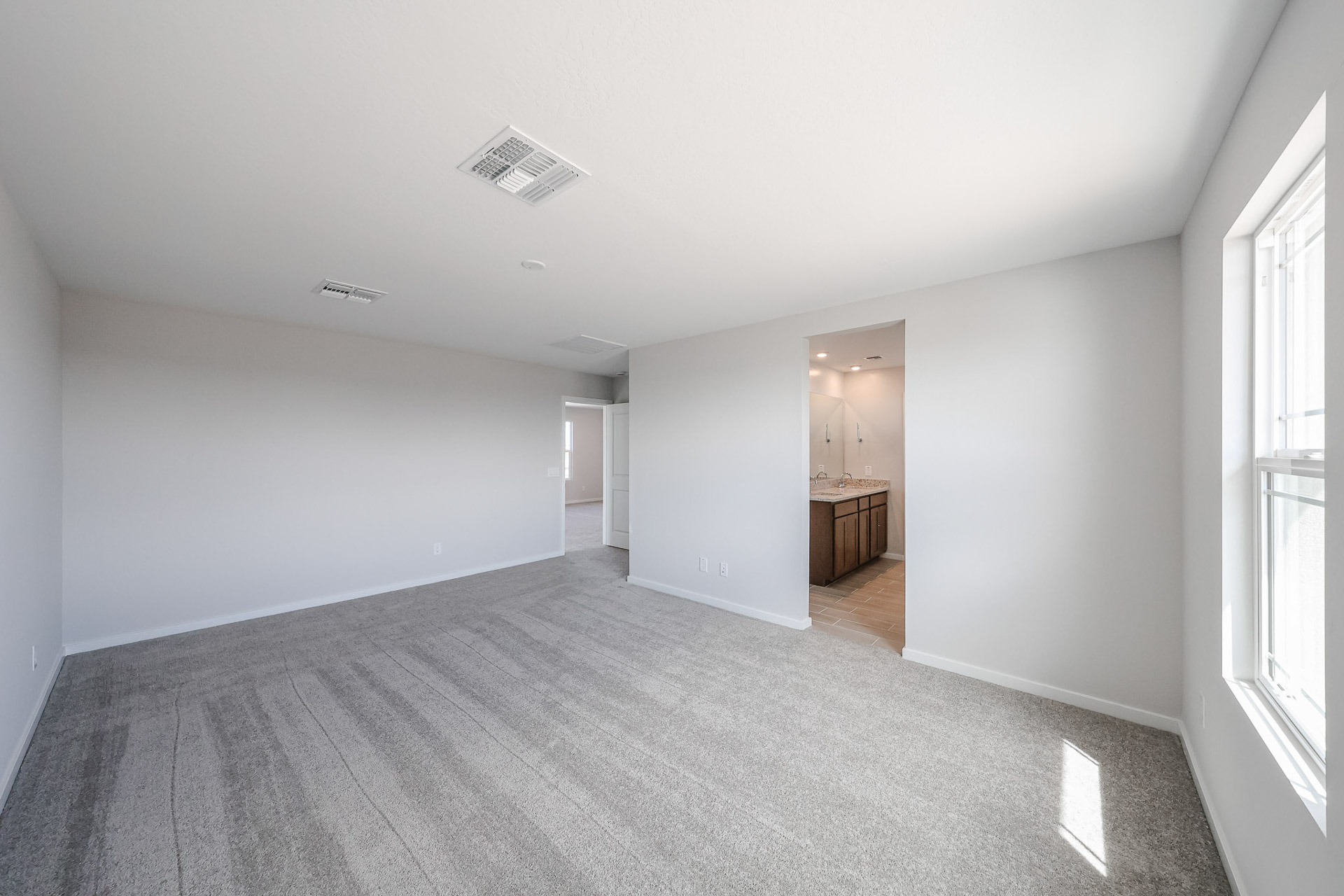 A long hallway with white walls.