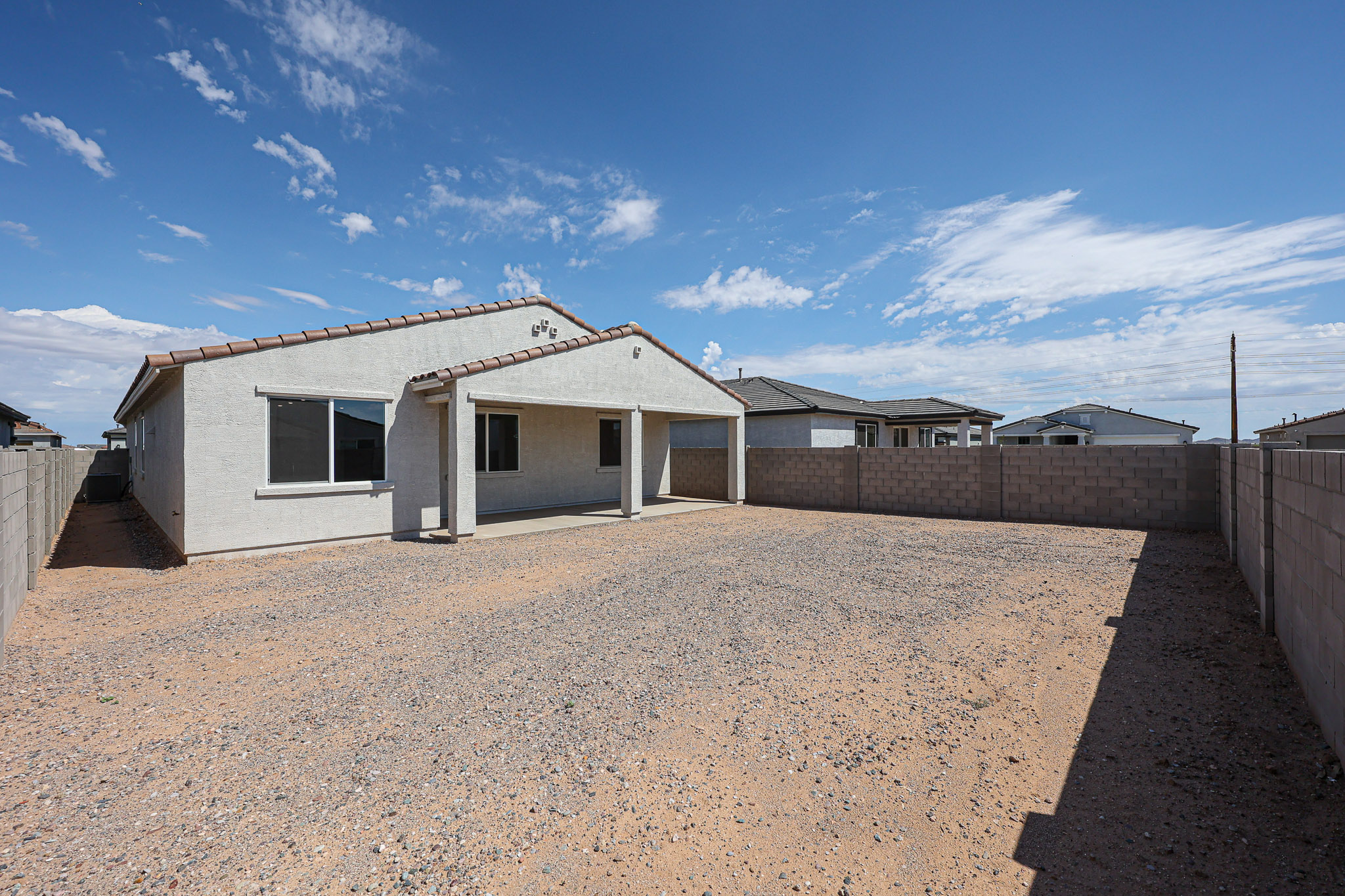 A house with a dirt yard.