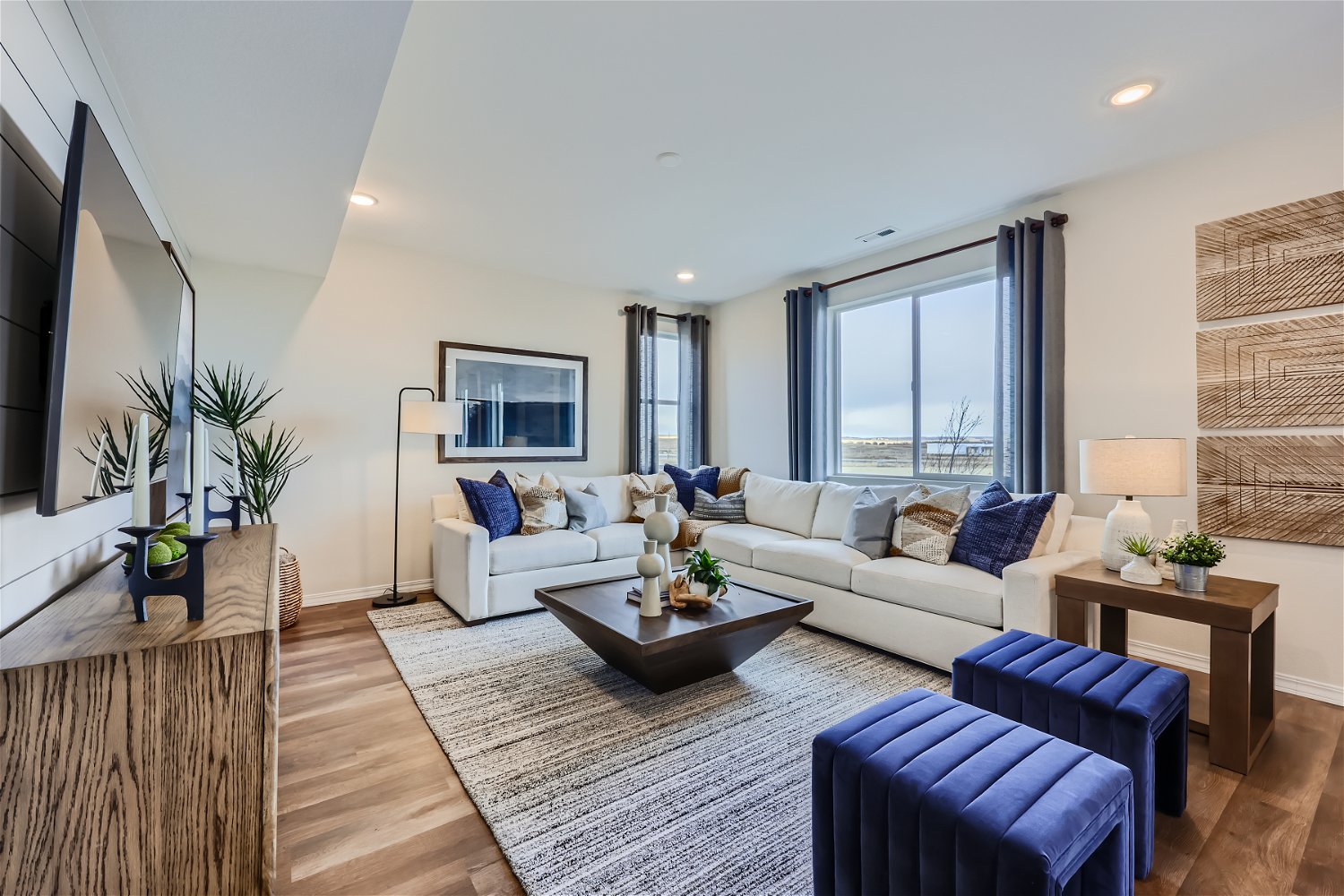 A living room with a large window.