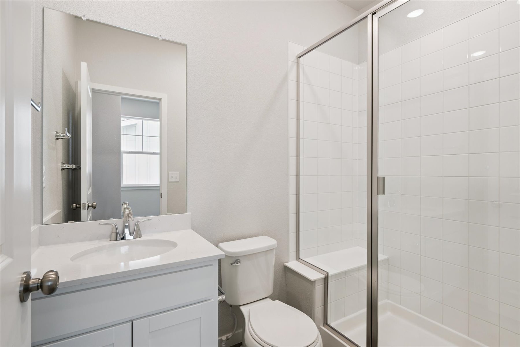 A bathroom with a glass shower.