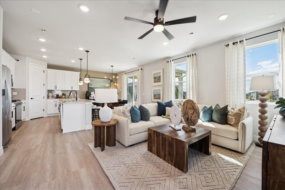 A living room with a wood floor.