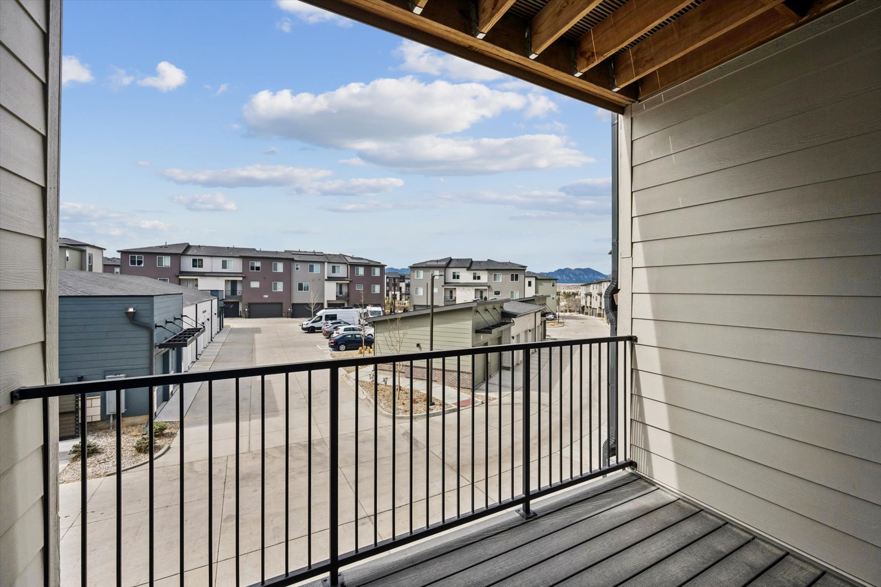 A view of a street from a balcony.
