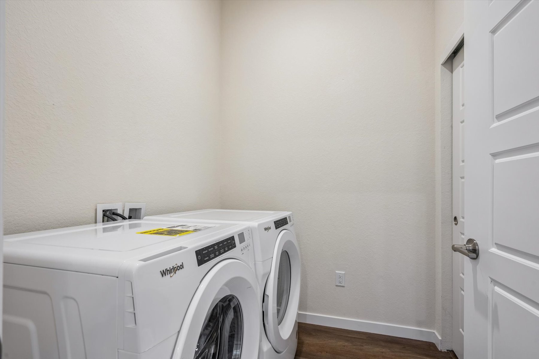 A white washing machine in a room.