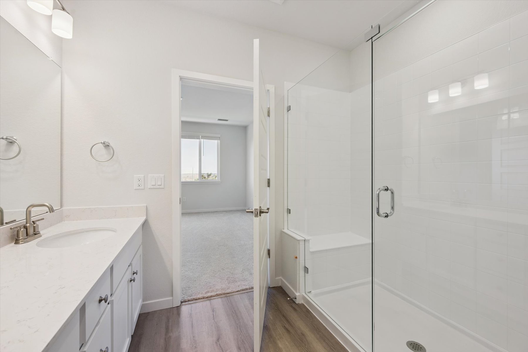 A bathroom with a glass shower.