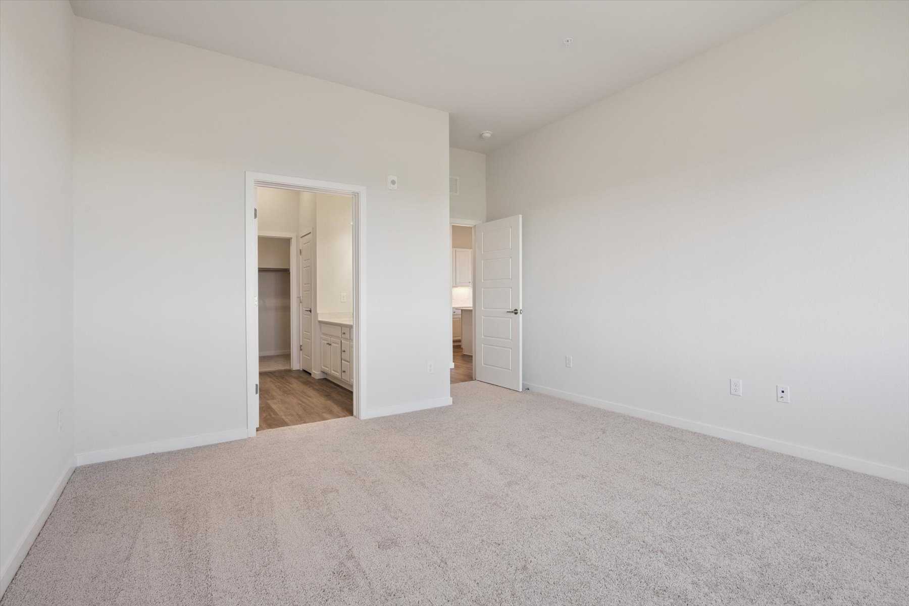 A hallway with white walls.
