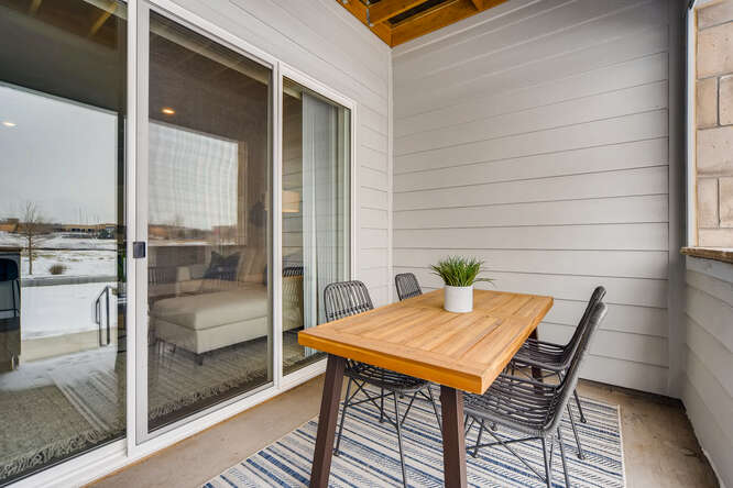 A table and chairs in a room.
