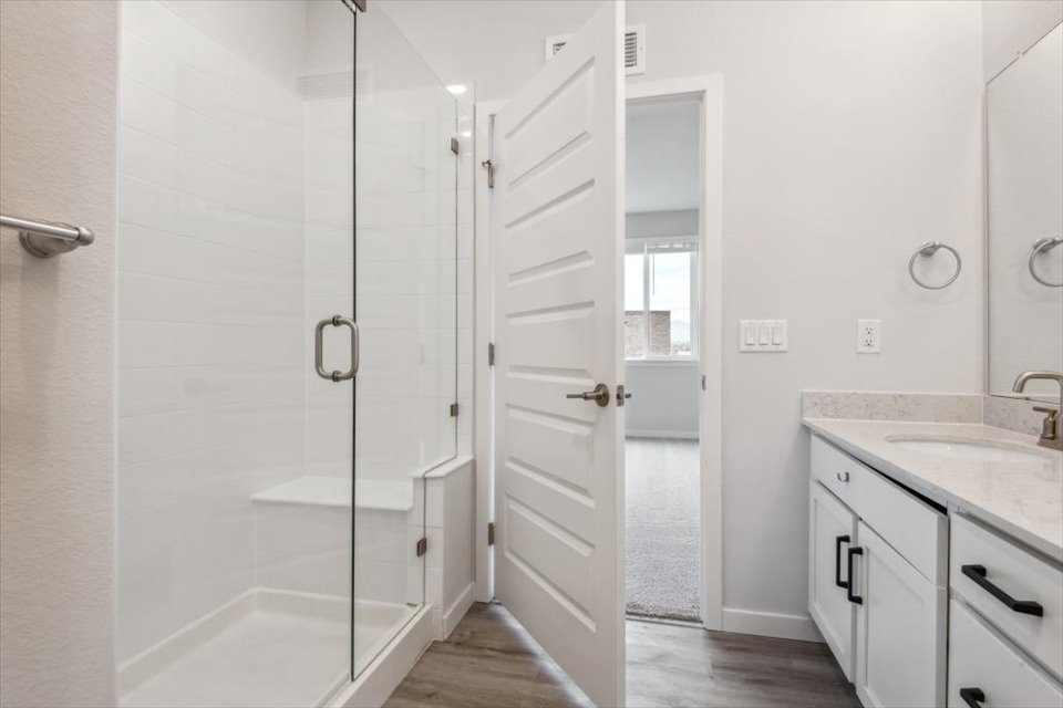 A bathroom with a glass shower.