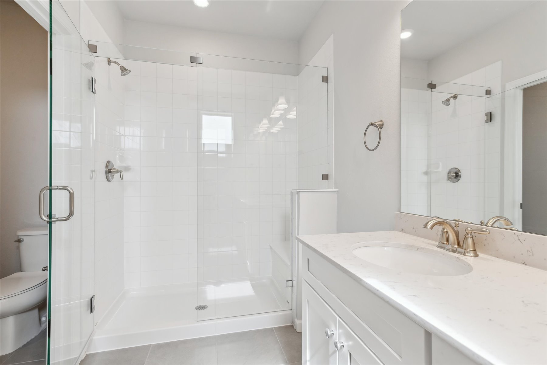 A bathroom with a glass shower.