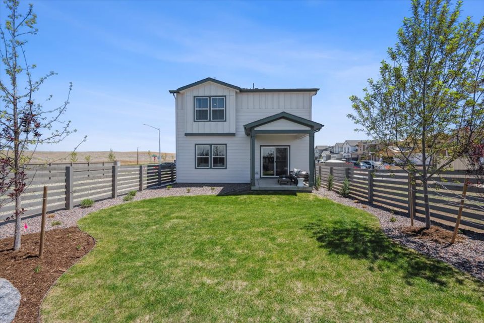 A small house in a grassy area.