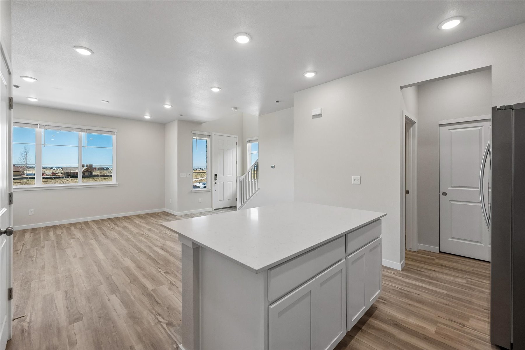 A large kitchen with white cabinets.