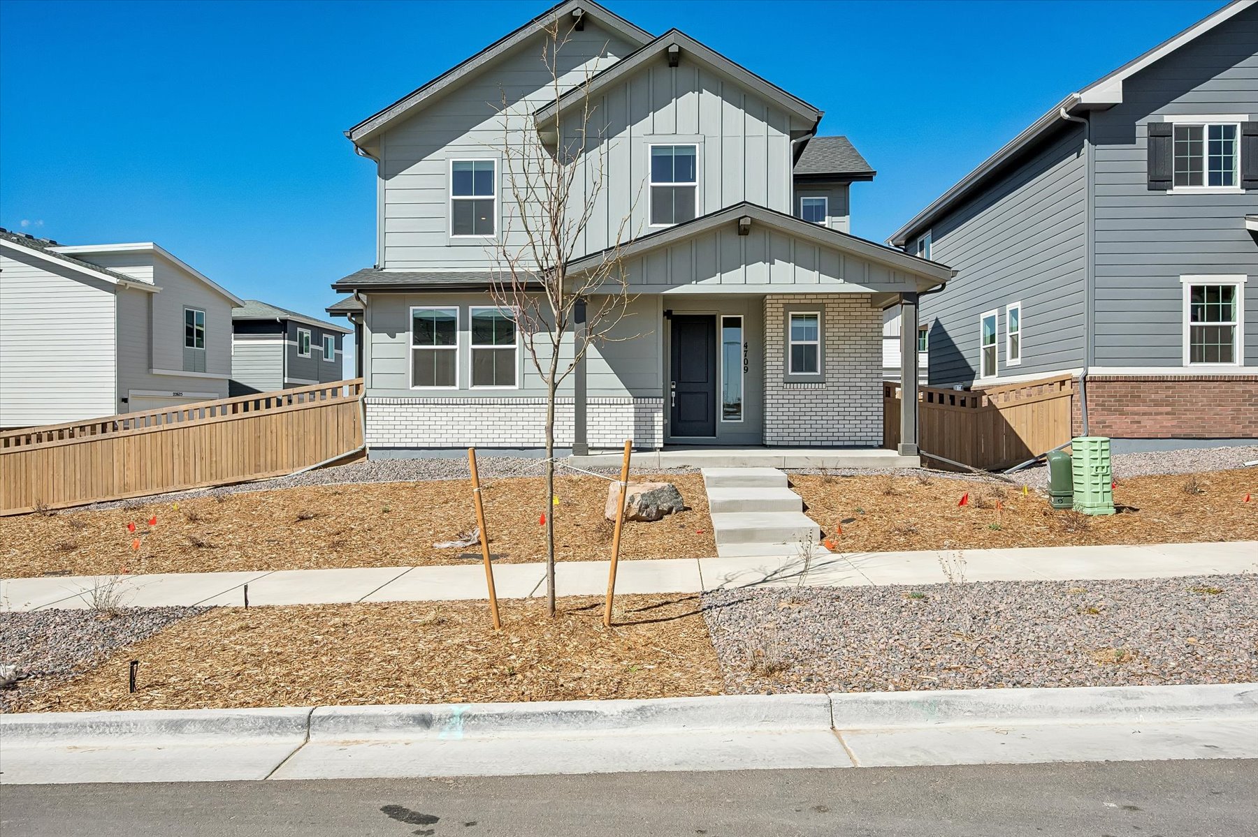 A house with a tree in front.