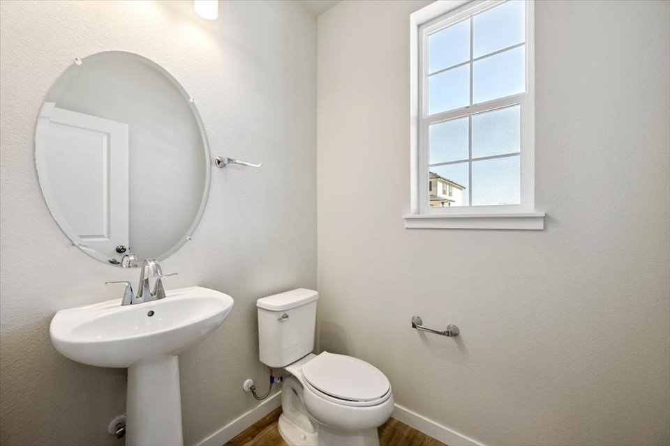 A bathroom with a sink and toilet.