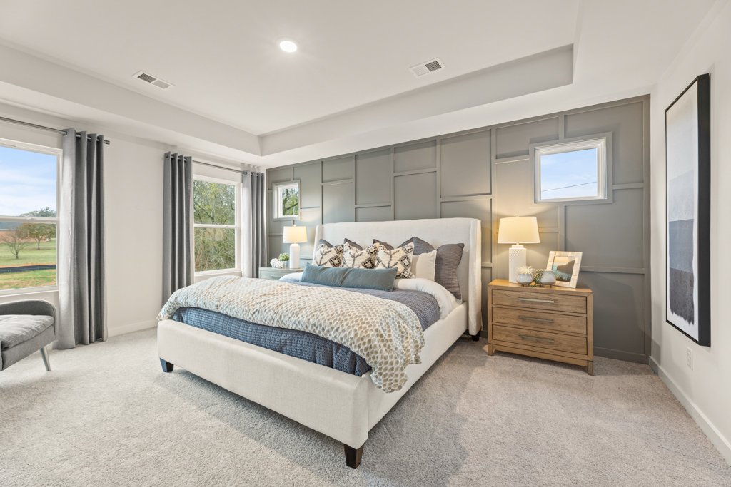 A bedroom with a large bed.