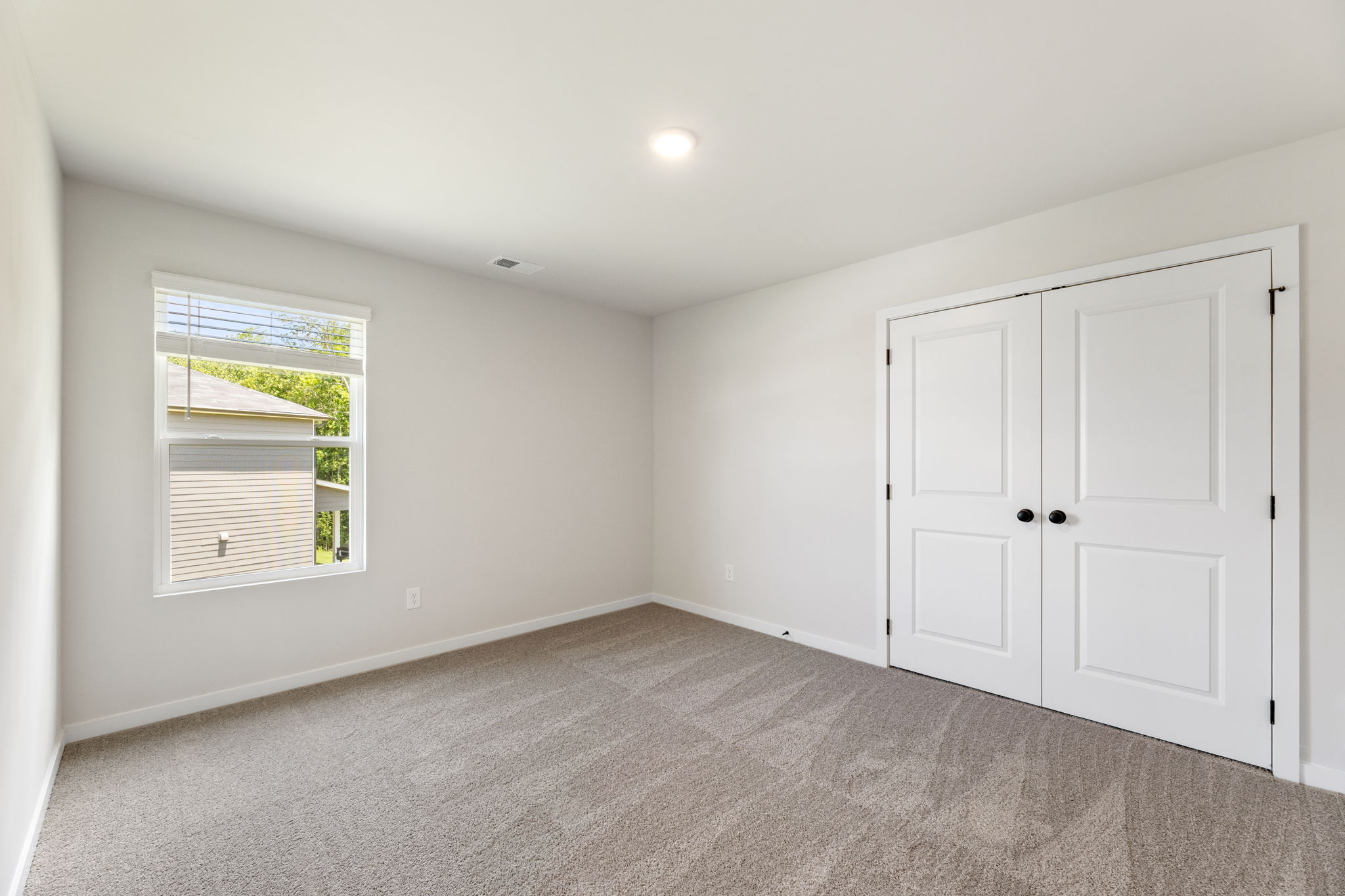 A room with white doors.