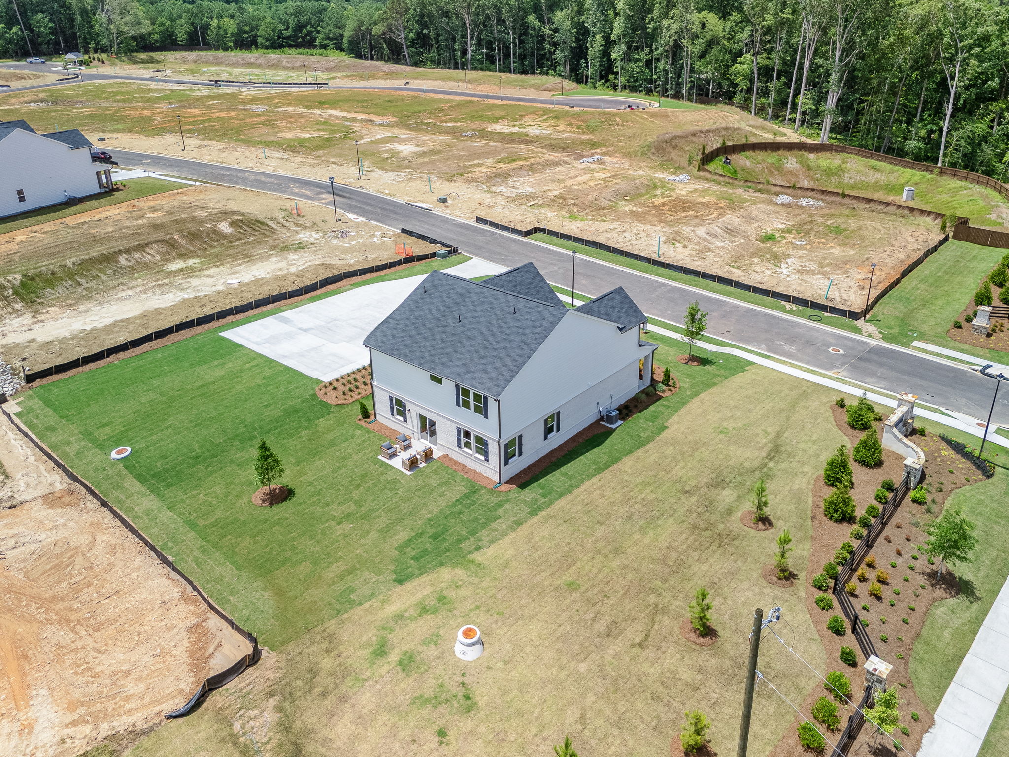 A large house with a parking lot.