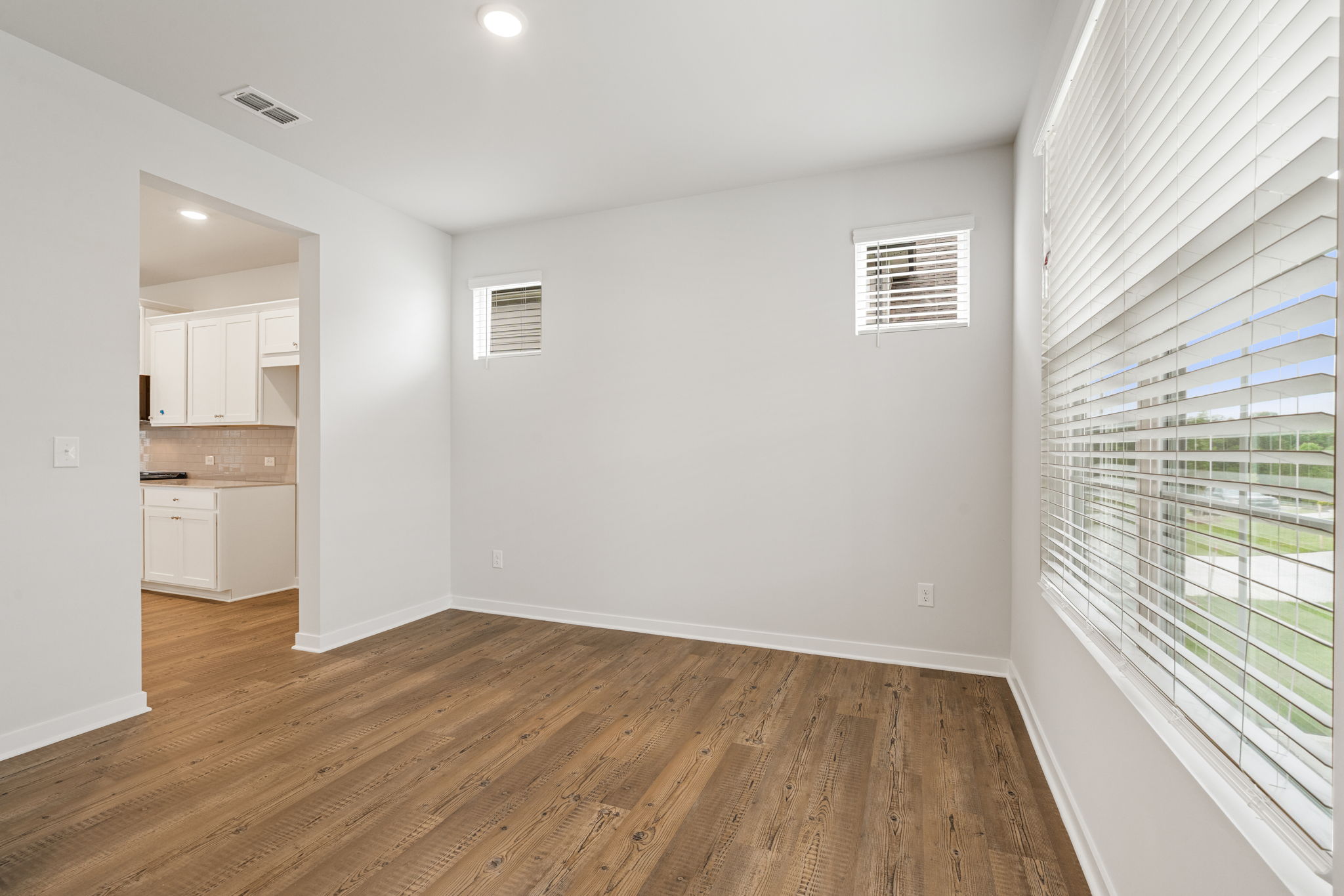 A room with a wood floor and a wood floor.