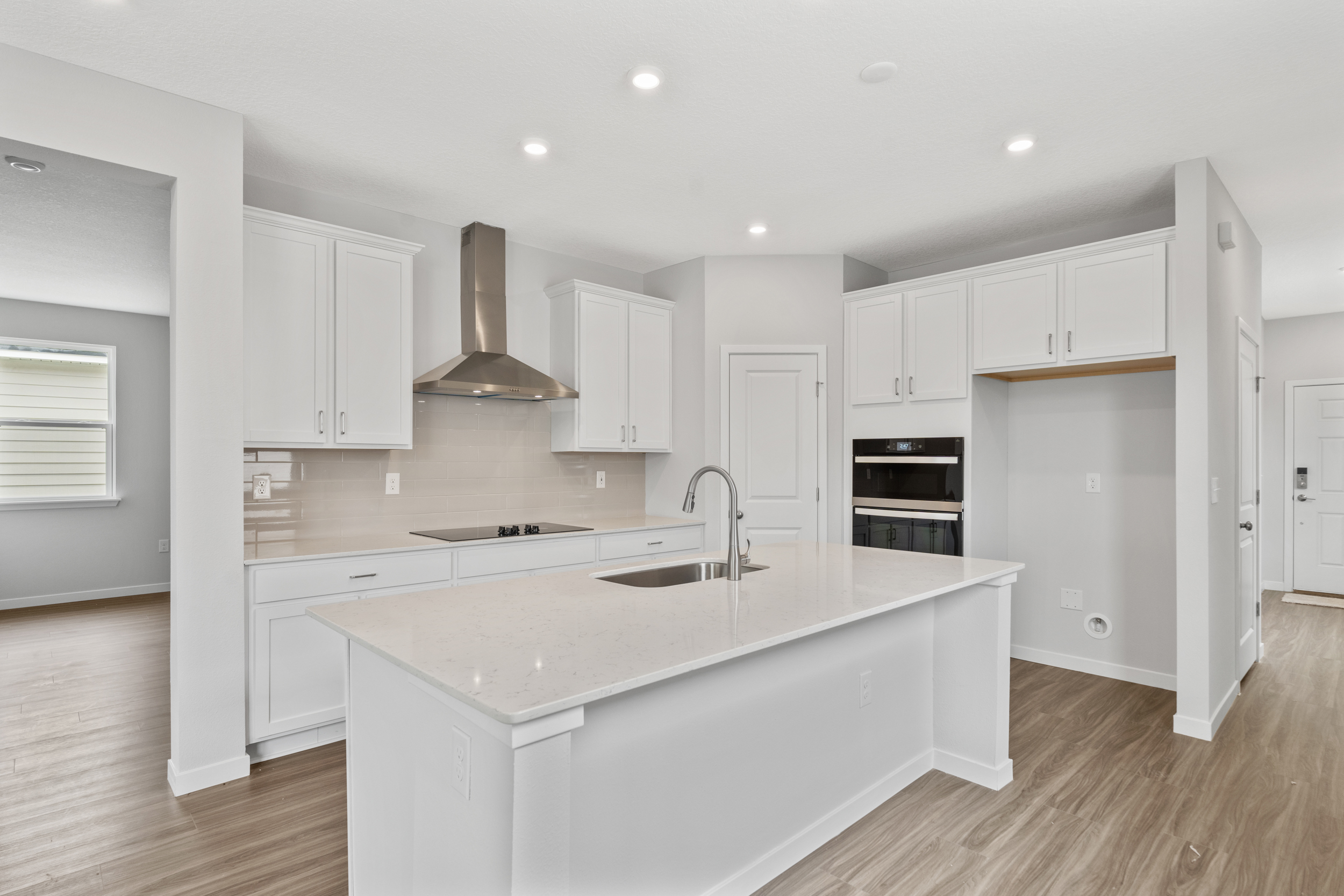 Captiva Floorplan Lot 56 Chef's Kitchen with White Cabinets at Seminole Palms in Palm Coast