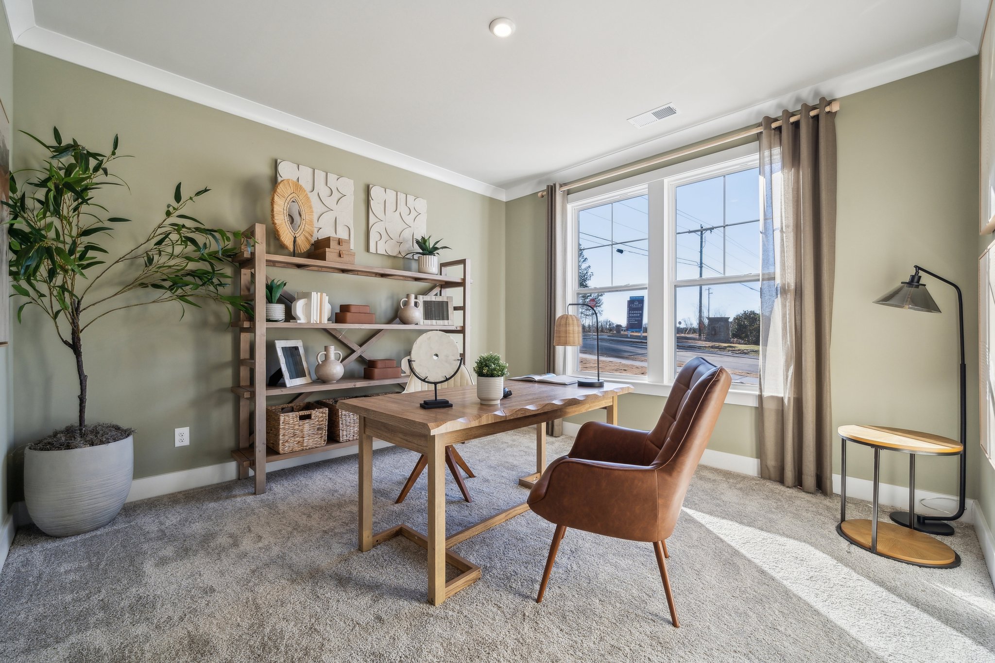 A living room with a table and chairs.