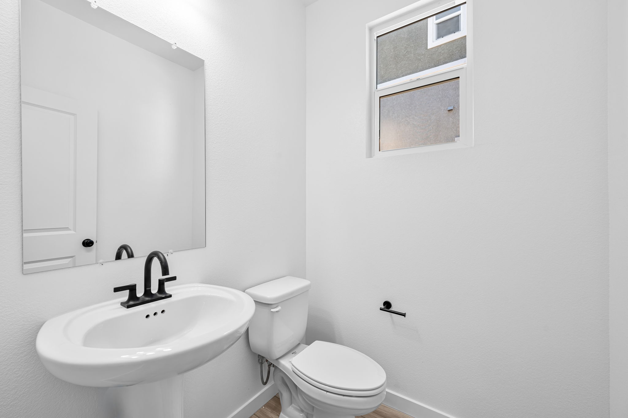 A bathroom with a sink and toilet.