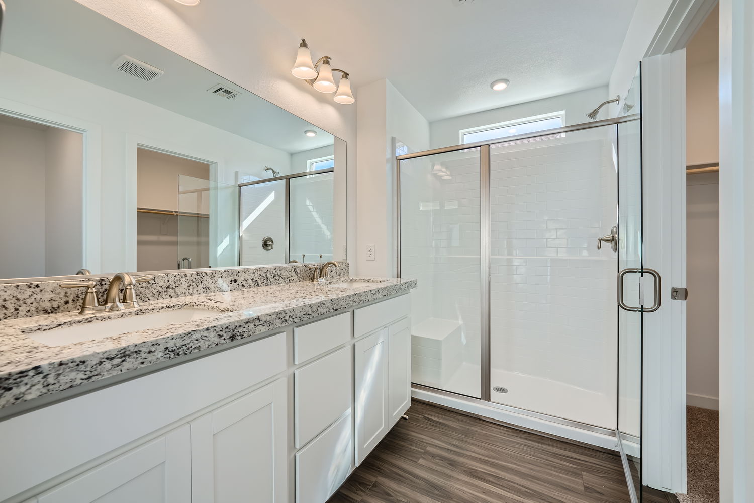 A bathroom with a marble countertop.