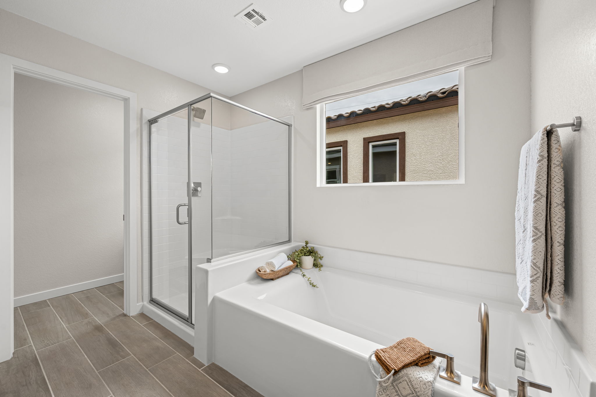 A bathroom with a tub and shower.