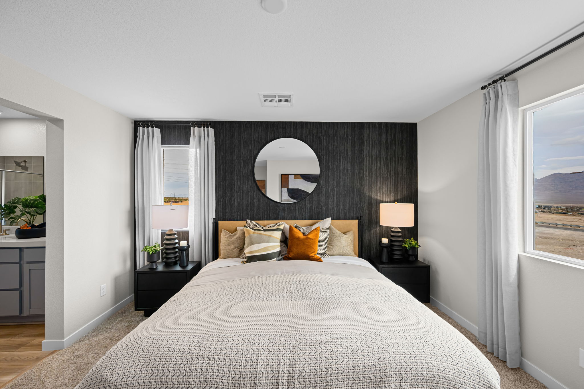 A bedroom with a large bed.