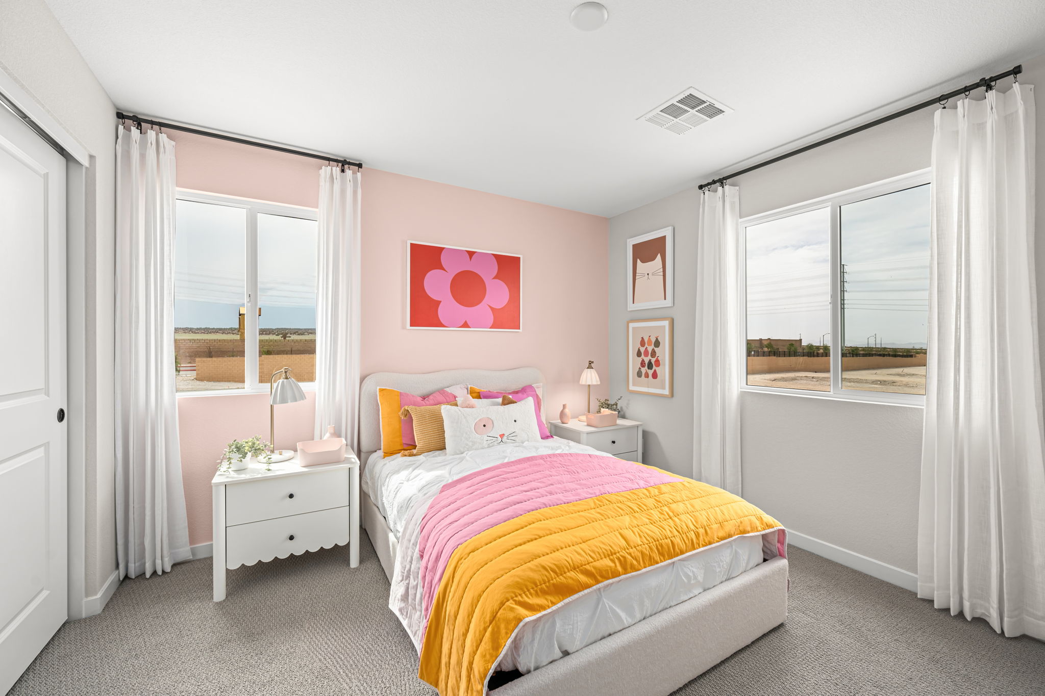 A bedroom with a bed and a window.