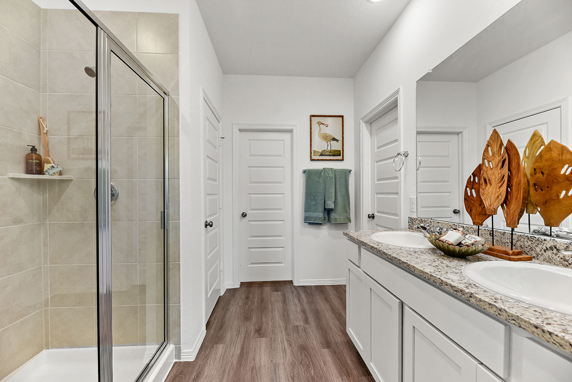 A bathroom with a glass shower.