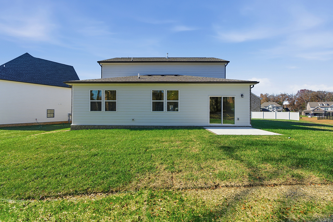 A house with a grass yard.