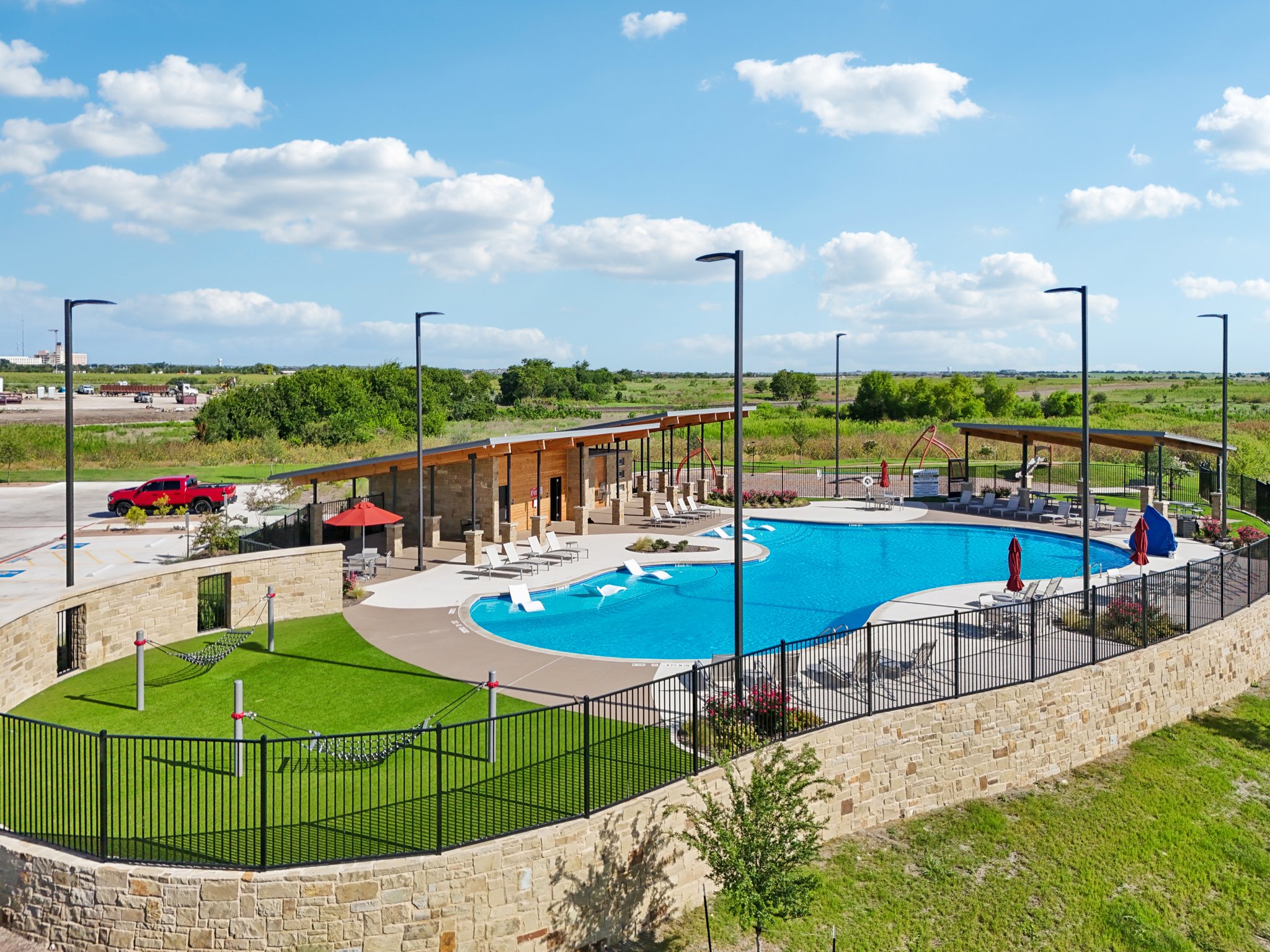 A swimming pool with a fence around it.