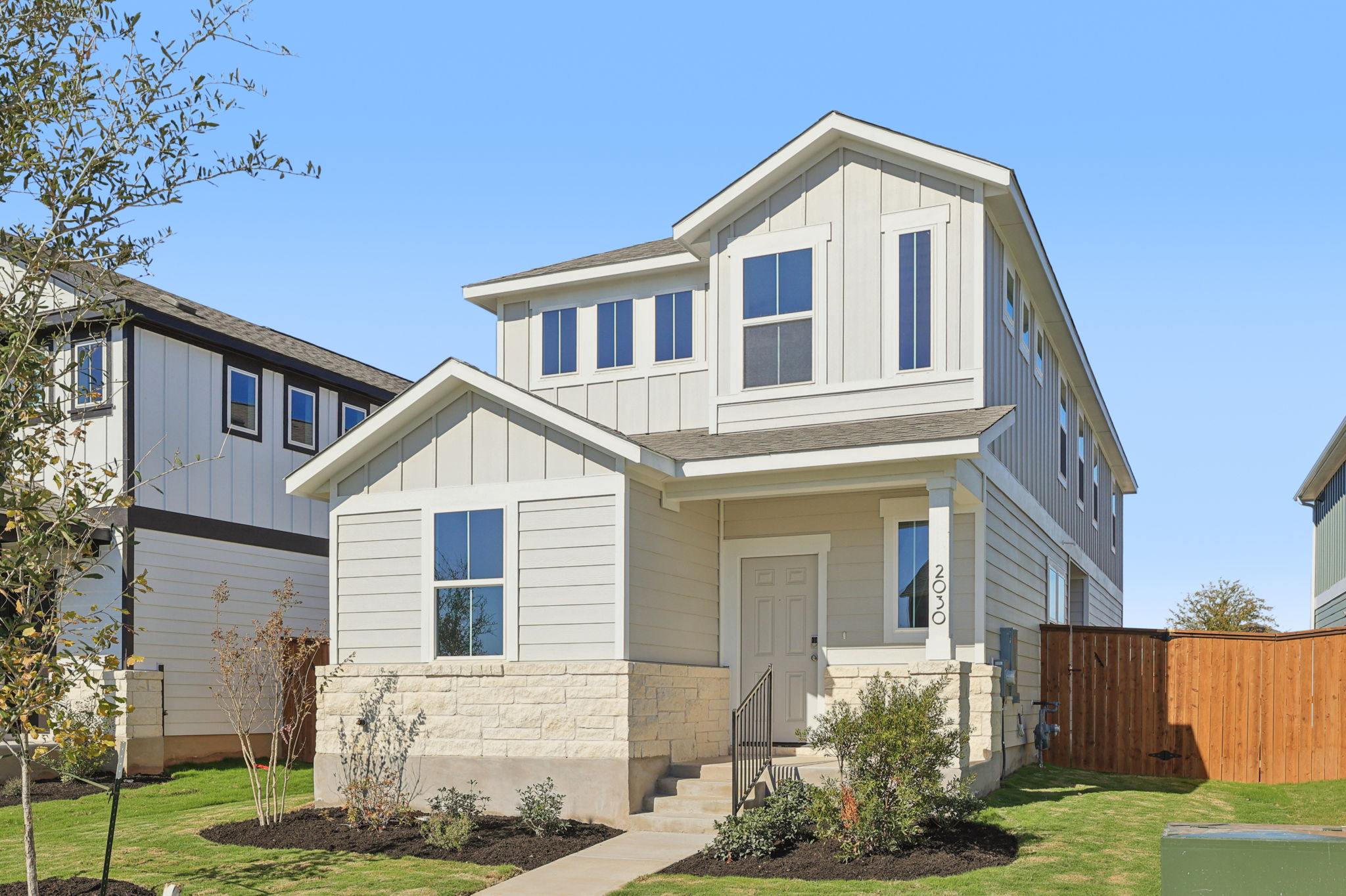 A white house with a fence.