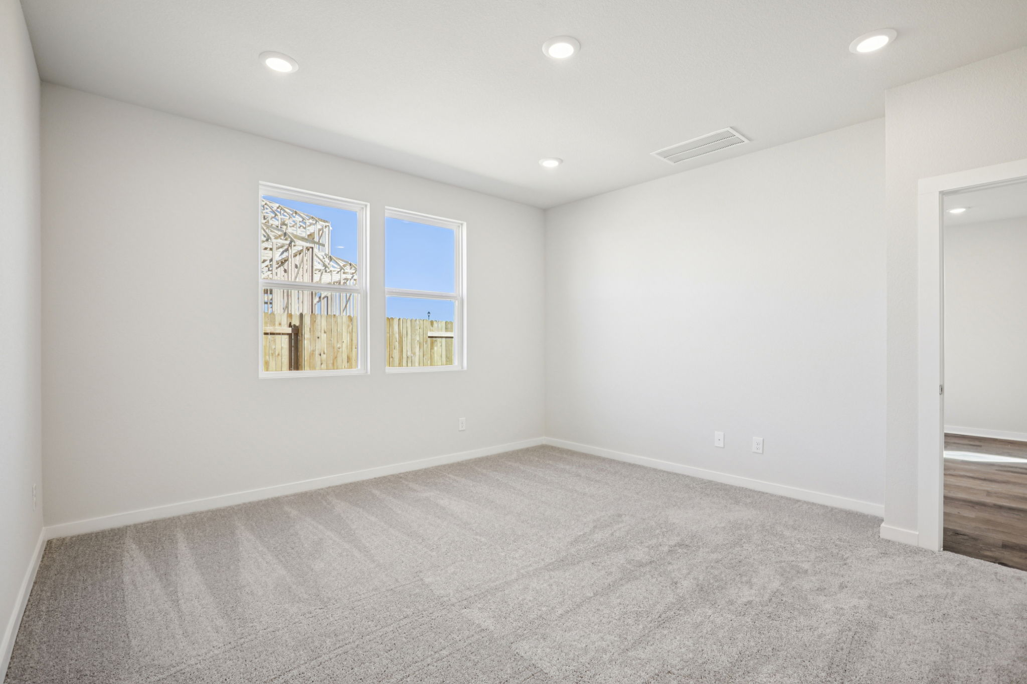 A room with a painting on the wall.