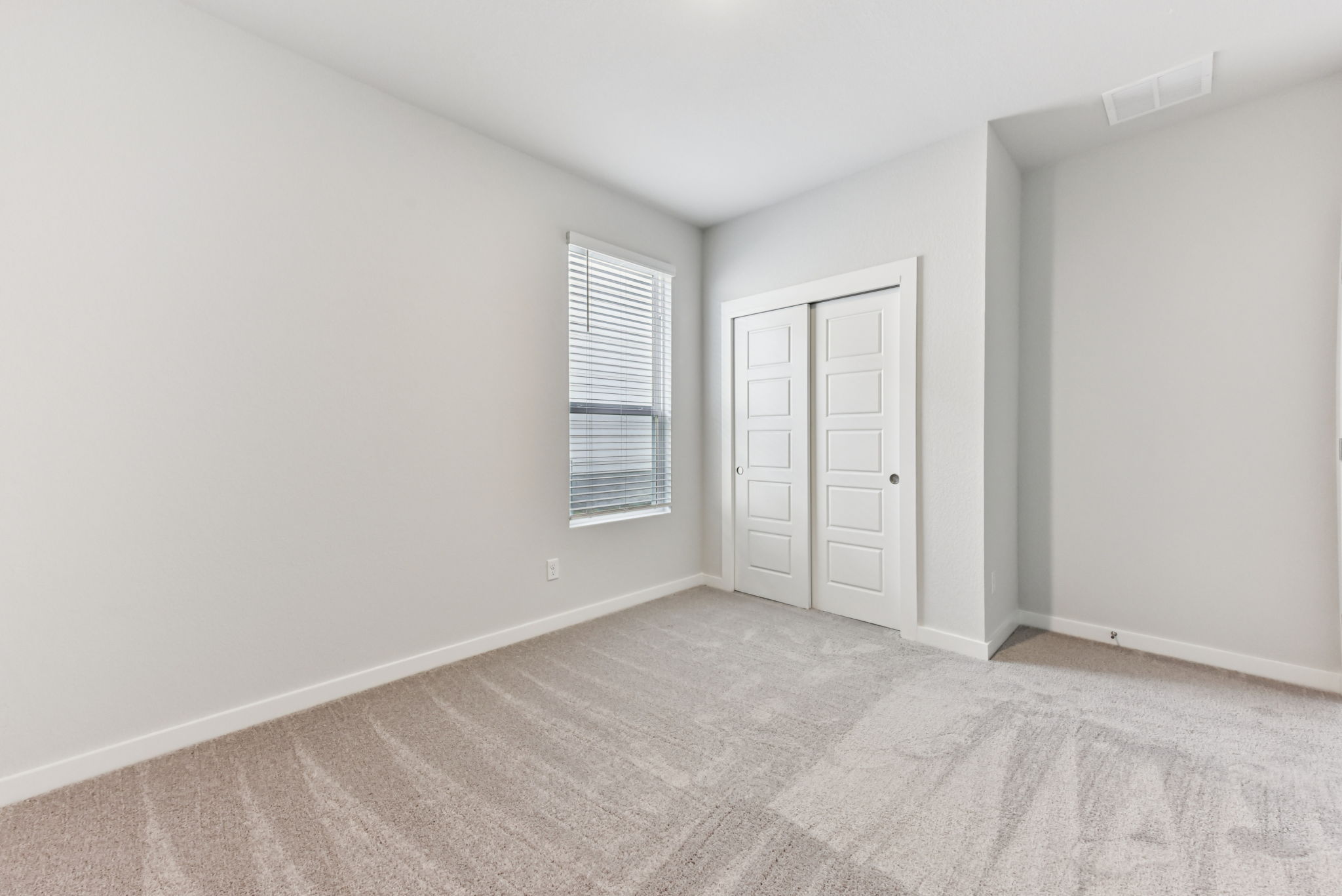 A room with a door and a window.