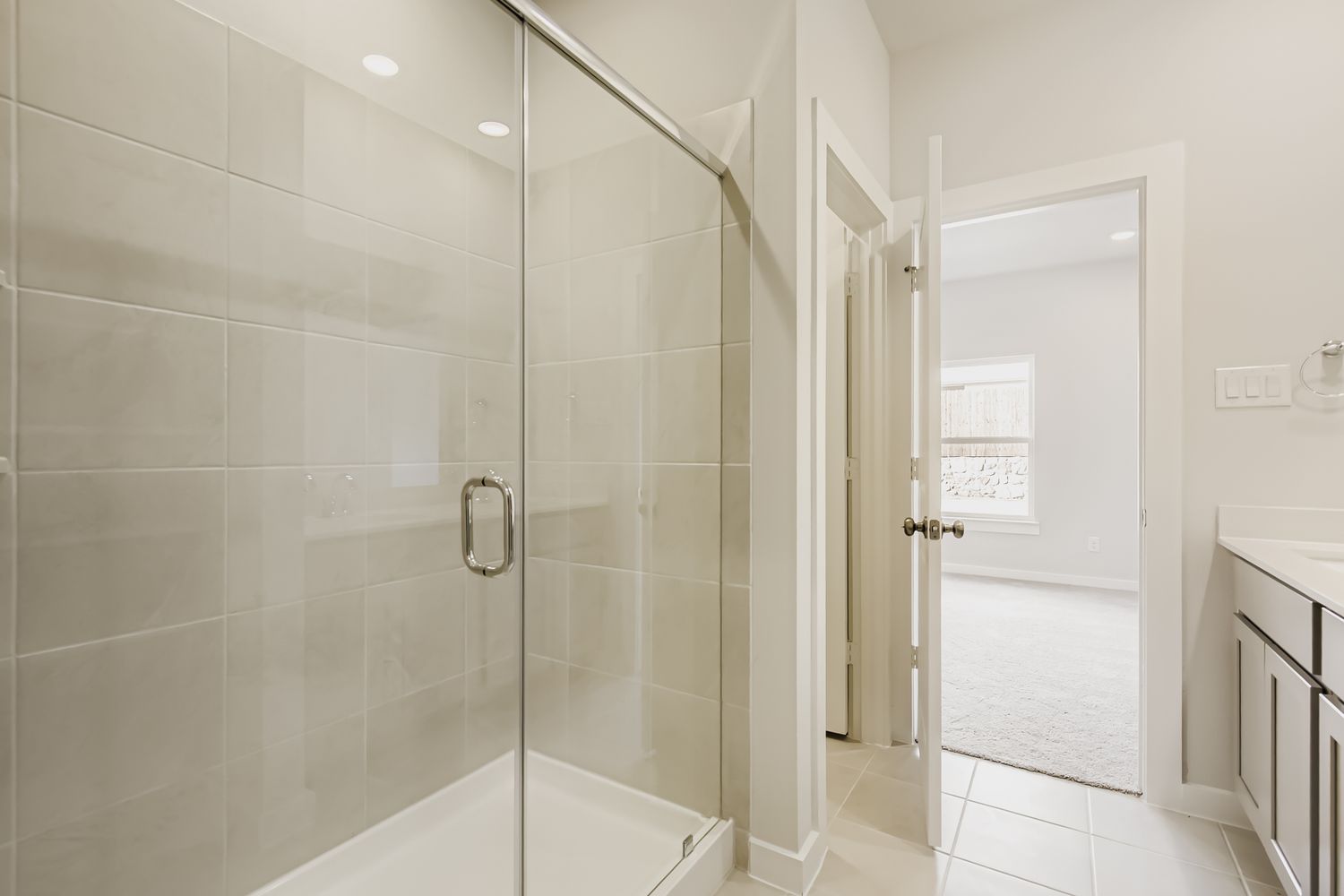 A bathroom with a glass shower.