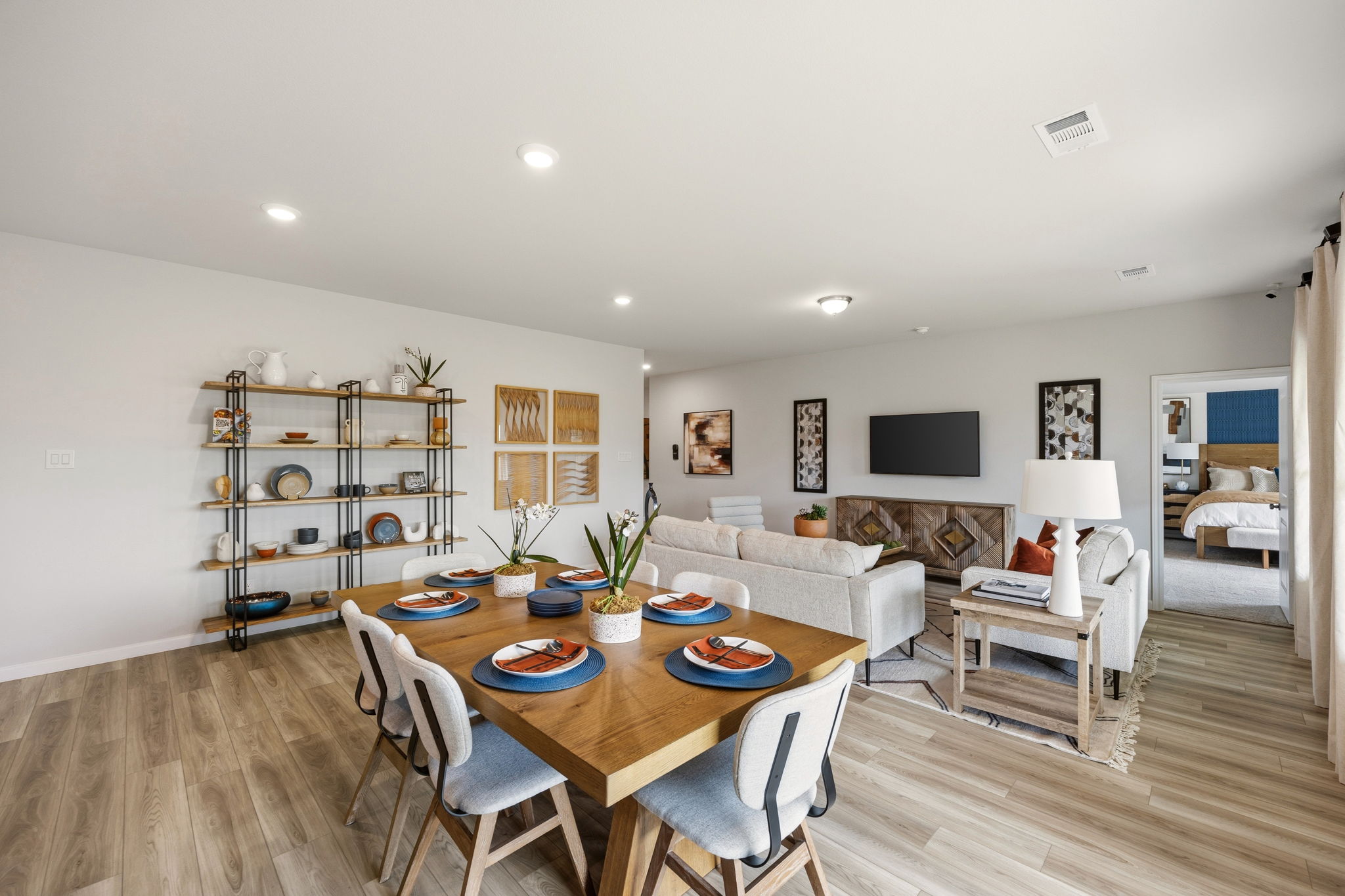 A large living room with a dining table and chairs.